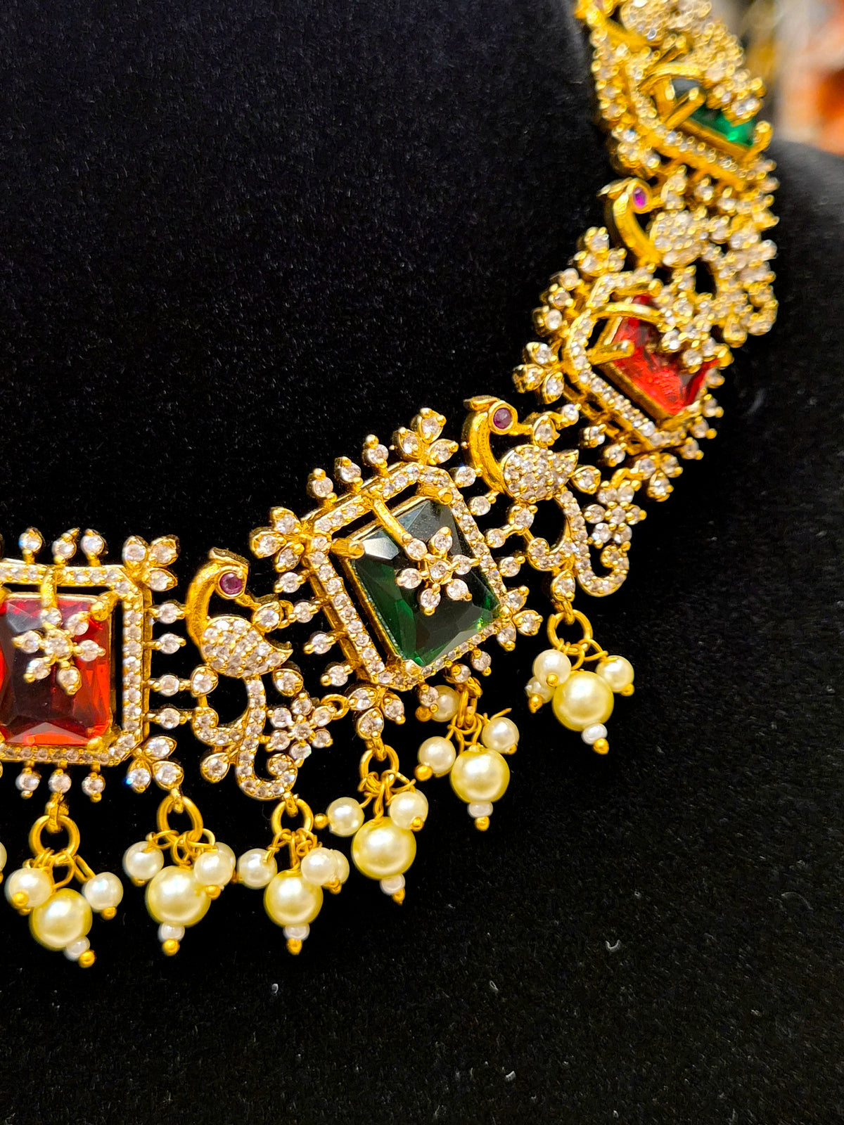 A.D GOLD PLATED NECKLACE WITH RED AND GREEN PREMIUM STONES AND WHITE BEADS